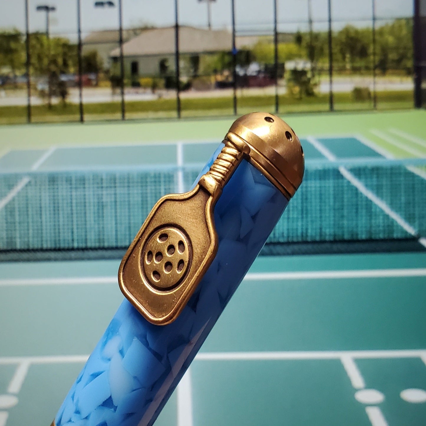 clip resembling a pickleball paddle
