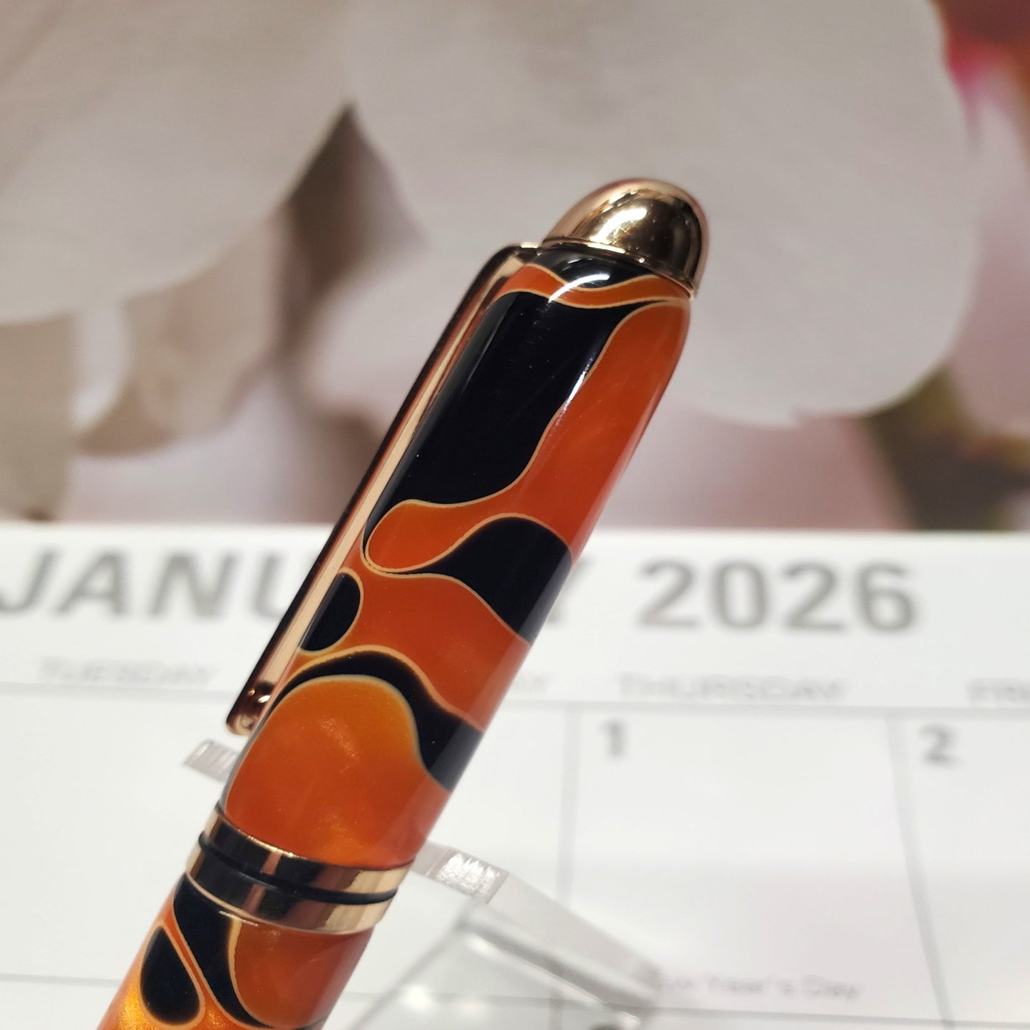 orange ball point pen resembling a tiger's pelt